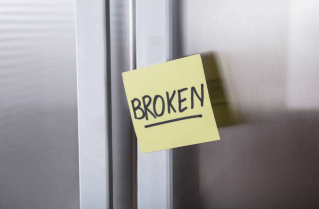 broken refrigerator in kitchen